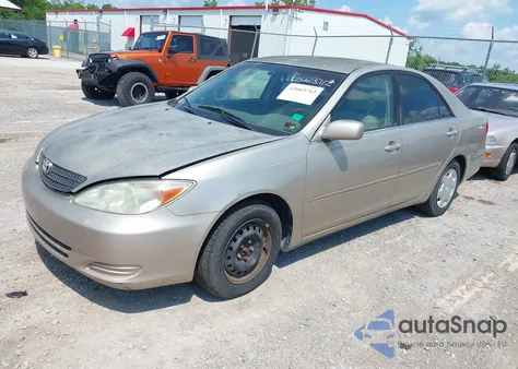 2002 Toyota Camry Le z USA, uszkodzony, nr VIN 4T1BE32K12U577914